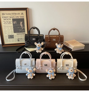 Detailed close-up of retro PU leather handbags in five colors with metal twist locks