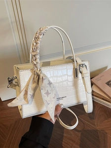 White faux leather crocodile pattern handbag with elegant houndstooth scarf handle detail