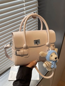 Vintage apricot leather handbag with metal lock and cute puppy plush charm for women
