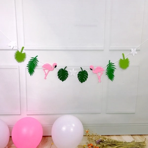 Tropical flamingo and monstera leaf garland decoration for Hawaii summer party