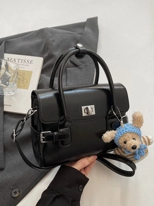 Classic black leather tote bag with silver twist lock and cute teddy bear charm