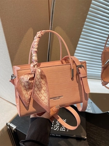 Pink croc-embossed handbag with silk scarf handle and adjustable shoulder strap