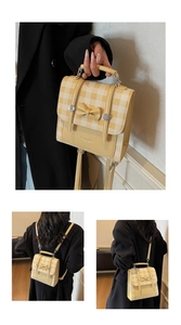 Detail of yellow checkered dual-use backpack featuring bow decor and metal magnetic buckle