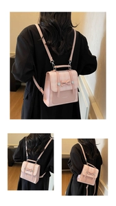 Close-up of pink checkered backpack with a decorative bow and adjustable leather straps
