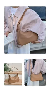 Detail showing the adjustable leather strap and side view of the camel hobo bag for women