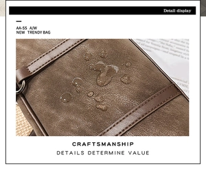 Macro detail of dark brown waterproof leather with water droplets and fine stitching