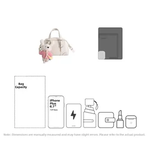Detail showing high-capacity cream leather handbag with cute accessories and internal storage