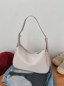 Chic beige lychee textured crescent hobo shoulder bag styled with casual outfits
