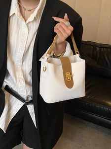 Minimalist beige and brown leather bucket bag with gold twist lock for women