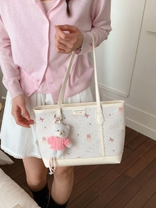 Cute beige large capacity tote bag with pink bow prints and a white bear charm