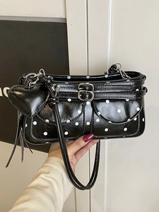 Retro black polka dot underarm bag with silver buckles and a heart charm