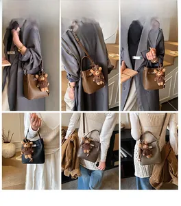 Model showcasing various ways to wear the textured bucket bag with metal twist lock