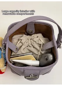 Detail view of large capacity interior with a removable cream drawstring inner pouch