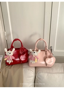 Retro shell handbag set with heart coin purses and plush rabbit charms in warm home setting