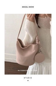 Pink PU leather bucket bag with knot detail and small round coin purse charm