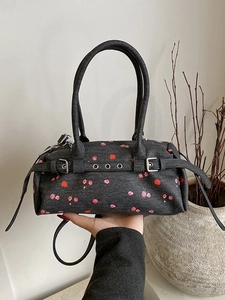 Denim cylinder handbag with red floral pattern and silver hardware for women