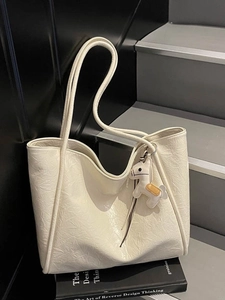 Creamy white large tote bag with pleated leather texture and a cute horse charm