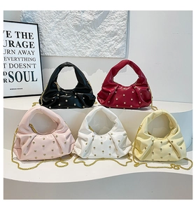 Collection of pleated cloud handbags in five colors with gold rivets and chain straps