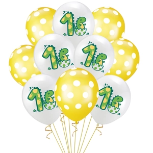 Detail of yellow polka dot and number one dinosaur latex balloons for first birthdays