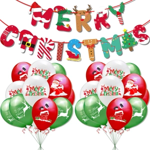 Close-up of Merry Christmas banner with Santa Claus elements and printed balloons