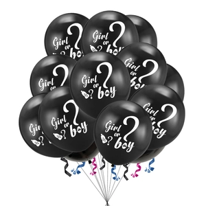 Detail of black Gender Reveal latex balloons with Girl or Boy print and colored ribbons
