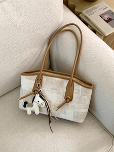 Large capacity chic beige fabric and brown leather tote bag with a horse pendant
