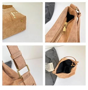 Dettagli borsa tote marrone in pelle scamosciata sintetica con borchie dorate e cerniera