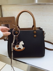 Chic black and brown contrast handbag with horse charm for office and daily wear