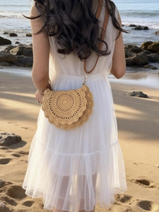 Straw hollow semi-circle saddle bag with brown shoulder strap for summer beach vacations