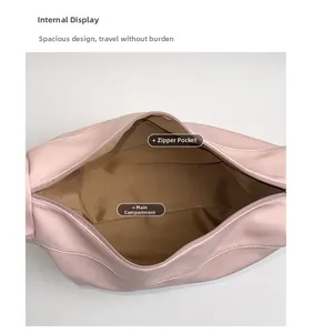 Internal view of pink shoulder bag showing spacious main compartment and zipper pocket