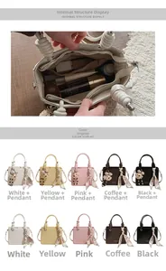 Internal view of minimalist handbag with storage for cosmetics and textured PU leather