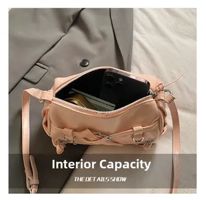 Interior view of the light pink baguette bag showing capacity for phone and small items