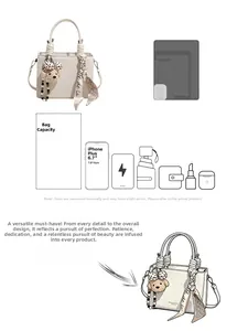Interior capacity of white leather tote bag showing space for phone and accessories