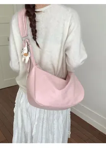 Pink oversized hobo shoulder bag with cute plush animal pendant for casual daily use