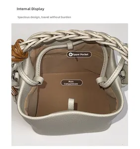 Macro detail of bucket bag interior featuring brown lining and zipper pocket