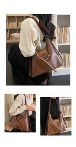 Dettagli della borsa tote marrone in pelle con fibbie decorative e tracolla regolabile
