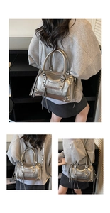 Detailed macro view of silver metallic rivet bag featuring punk tassels and studs