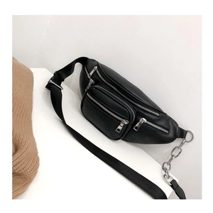 Detail view of black PU leather chest bag featuring silver metal zippers and chunky chain