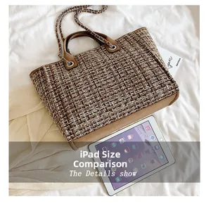 Tweed bucket bag with chain handle shown in size comparison next to an iPad