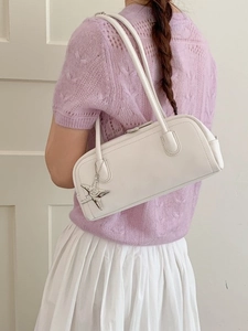 Minimalist white leather bowling shoulder bag with star charm and double handles