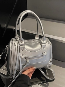 Silver rivet boston bag with tassel detail and adjustable shoulder strap for women