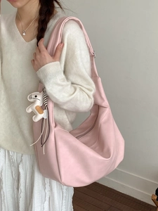 Pink crescent hobo bag in matte leather with decorative horse charm for women