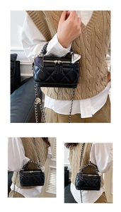Detail of black quilted mini bag with golden hardware and floral silk scarf handle