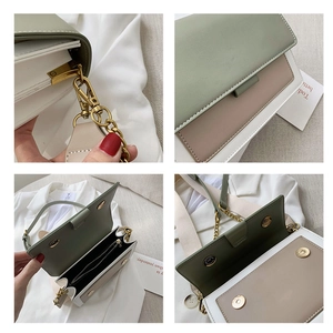 Borsa a tracolla bicolore verde e beige con catena dorata e ampia tracolla in tessuto