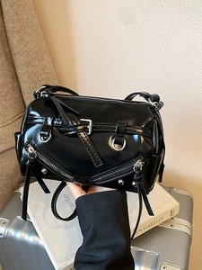 Glossy black Boston bag with punk-style silver zippers and metallic buckle decorations
