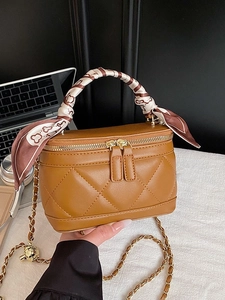 Brown quilted box handbag with silk scarf handle and adjustable gold chain strap