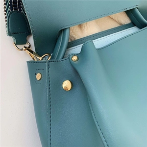 Morandi teal tote bag with plush lining and geometric woven shoulder strap detail