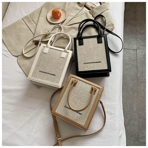 Detail of tweed crossbody square bags with leather trim in cream, black, and brown colors
