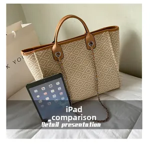 Detail view of woven bucket bag showing large capacity for items like an iPad