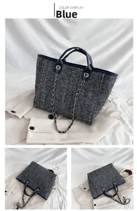 Blue tweed tote bag details showing leather handles and metal chain shoulder strap
